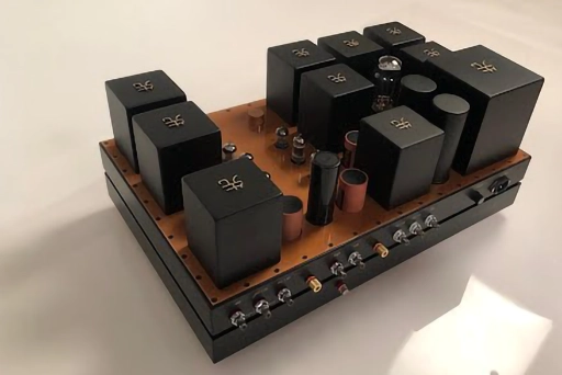 A Phono Stage amplifier on a base, featuring multiple black electronic components.
