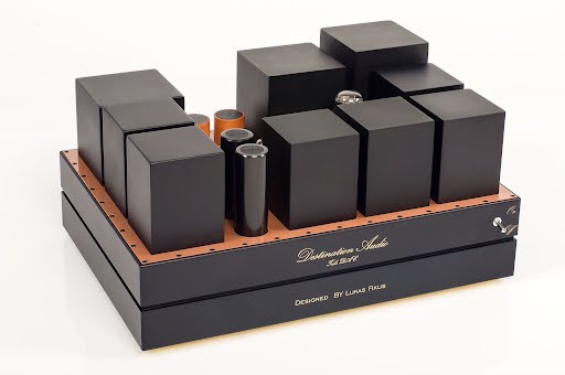 A high-end Digital-to-Analog Converter with a black and copper finish, featuring multiple black rectangular components and labeled "Destination Audio" on the front.