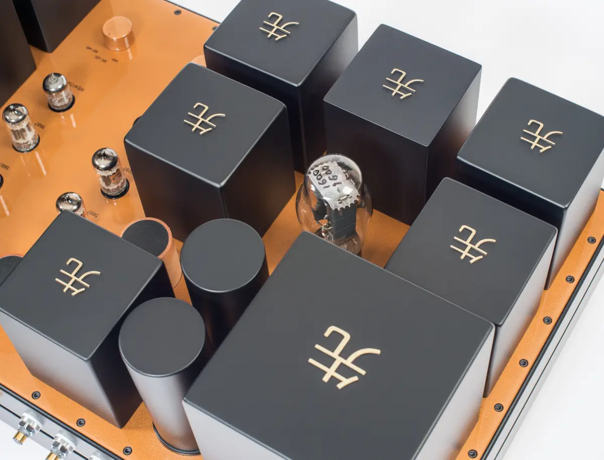 Close-up of the black transformer housings and tubes on the copper-colored top of the Destination Audio WE417A phono stage